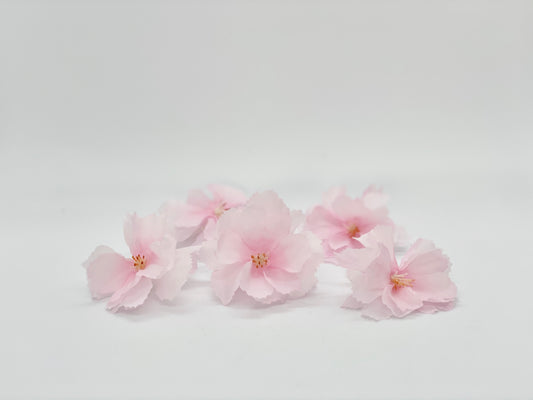 Set of 5 light pink faux cherry blossoms side view showing 2.5-inch bloom size