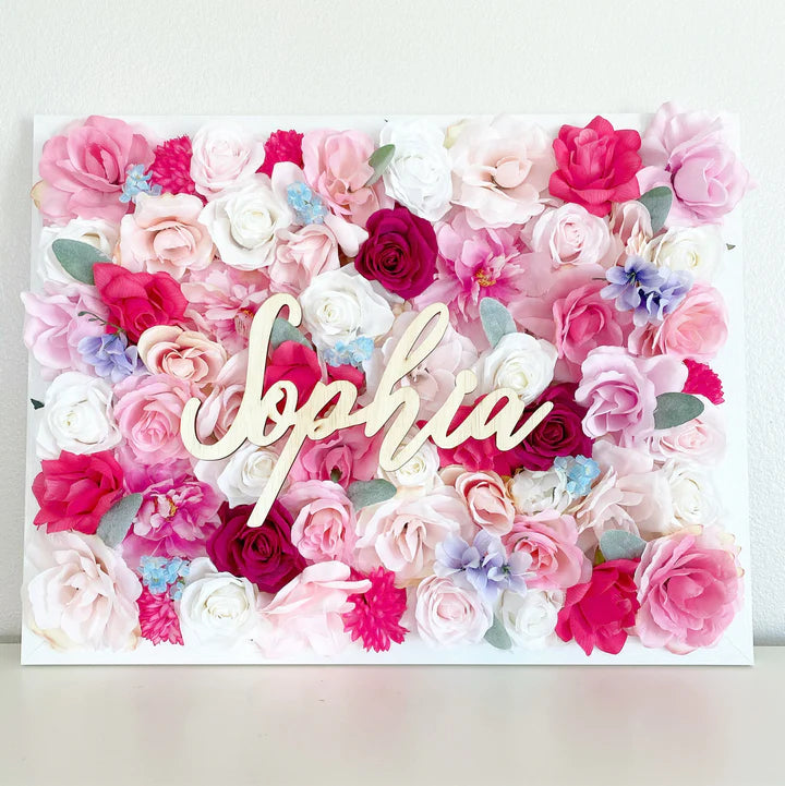 Silk flower wall name sign boutique branding backdrop