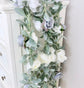 Dusty blue wedding garland ceremony decor