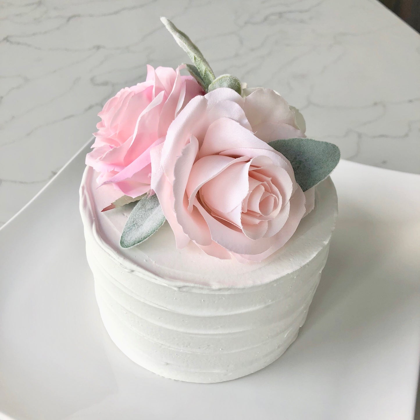 Floral birthday decor cake table arrangement