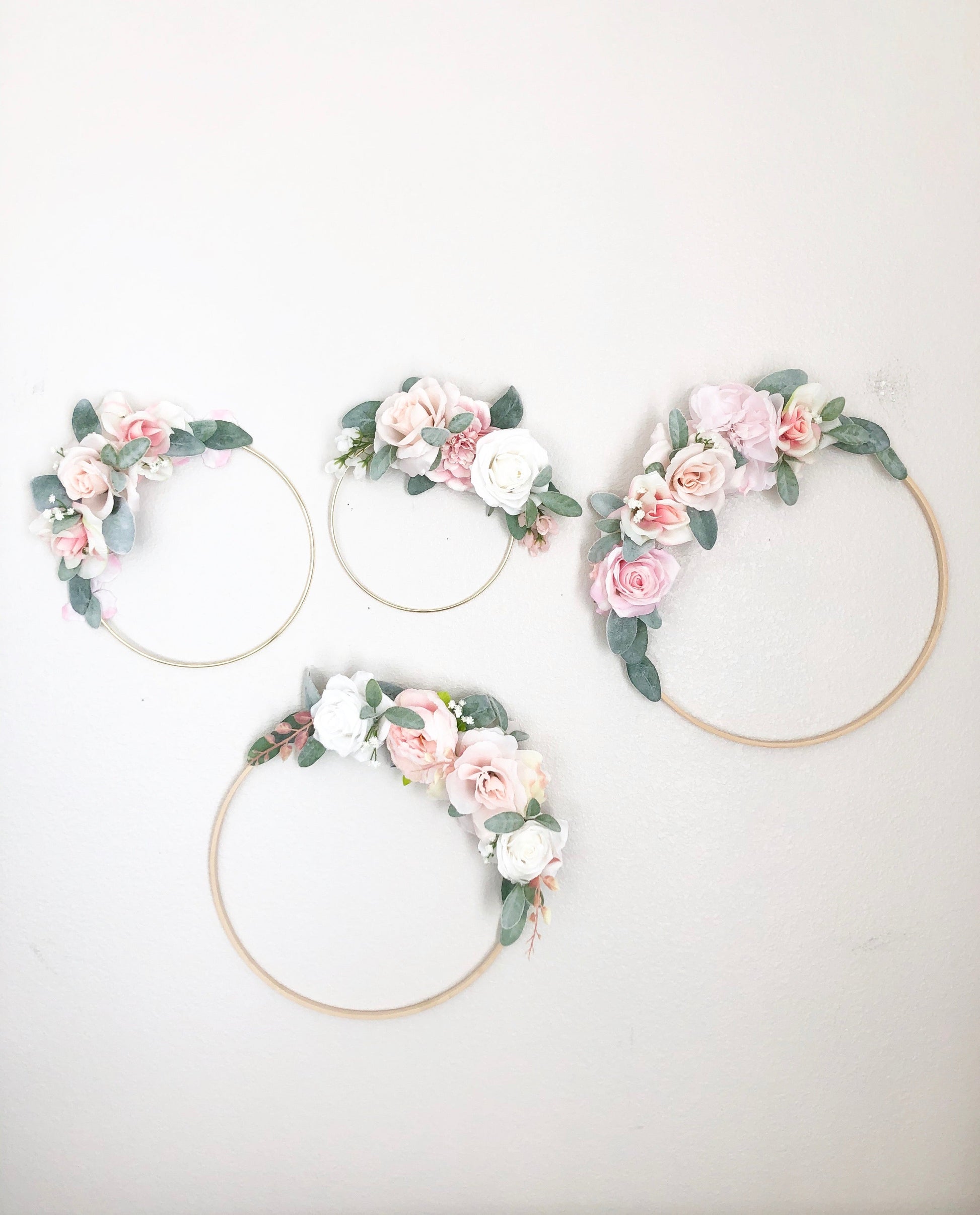 Floral hoop wall hanging with custom text for baby room