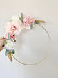 Custom floral hoop wreath with personalized lettering detail