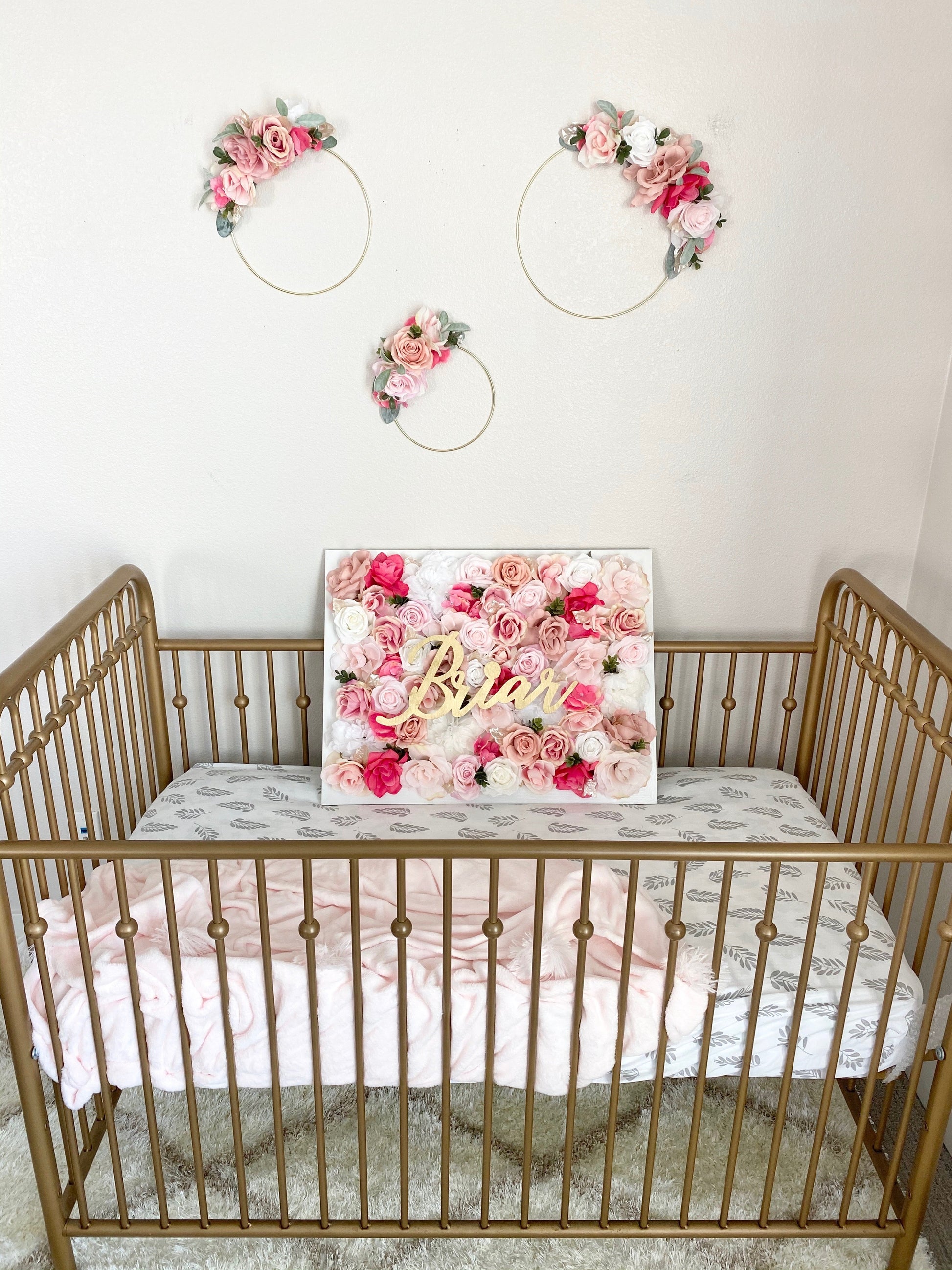 Personalized floral hoop with custom text for nursery wall