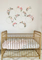Floral hoop wreath detail showing custom lettering and flowers