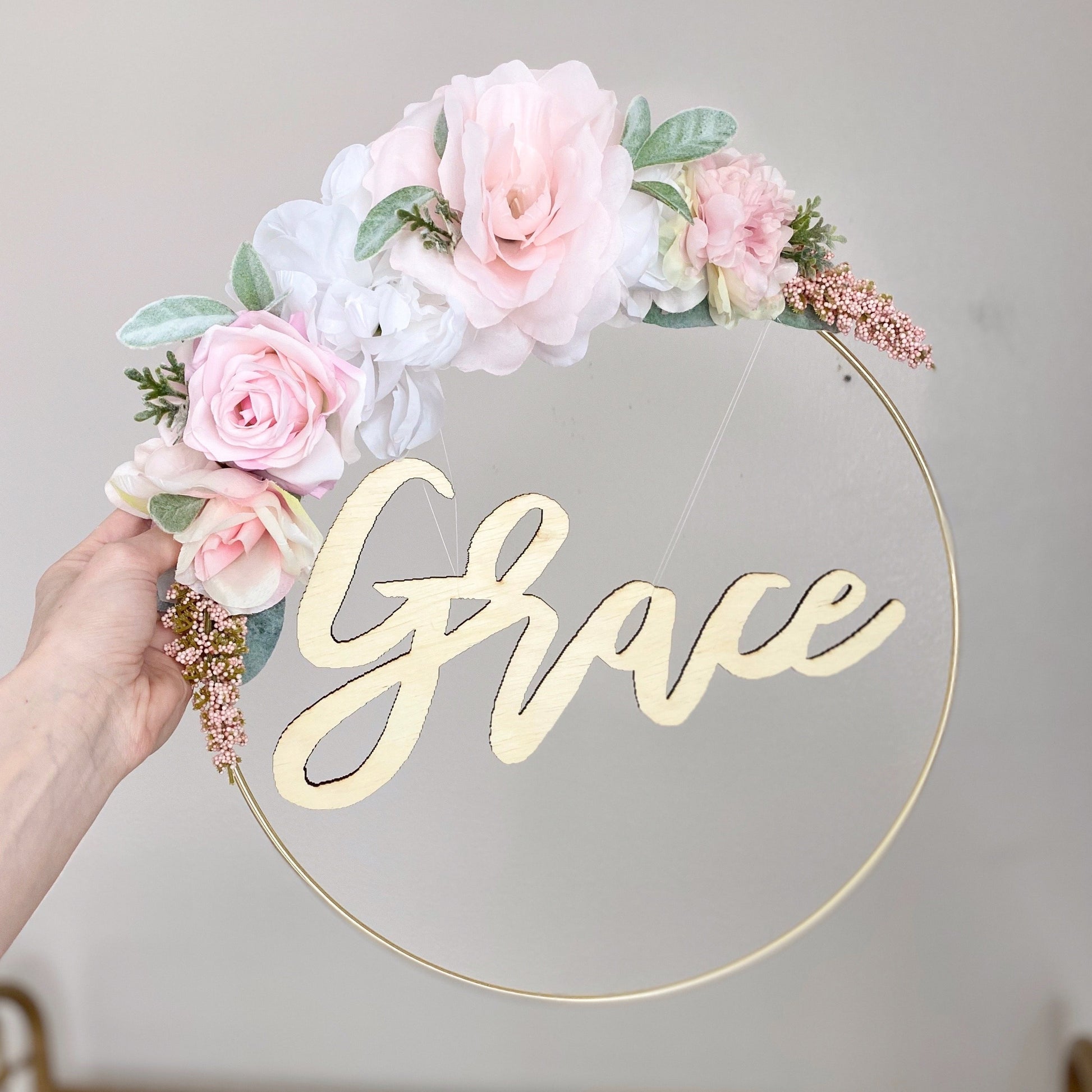 Close-up spring flower hoop wreath detailed silk blooms