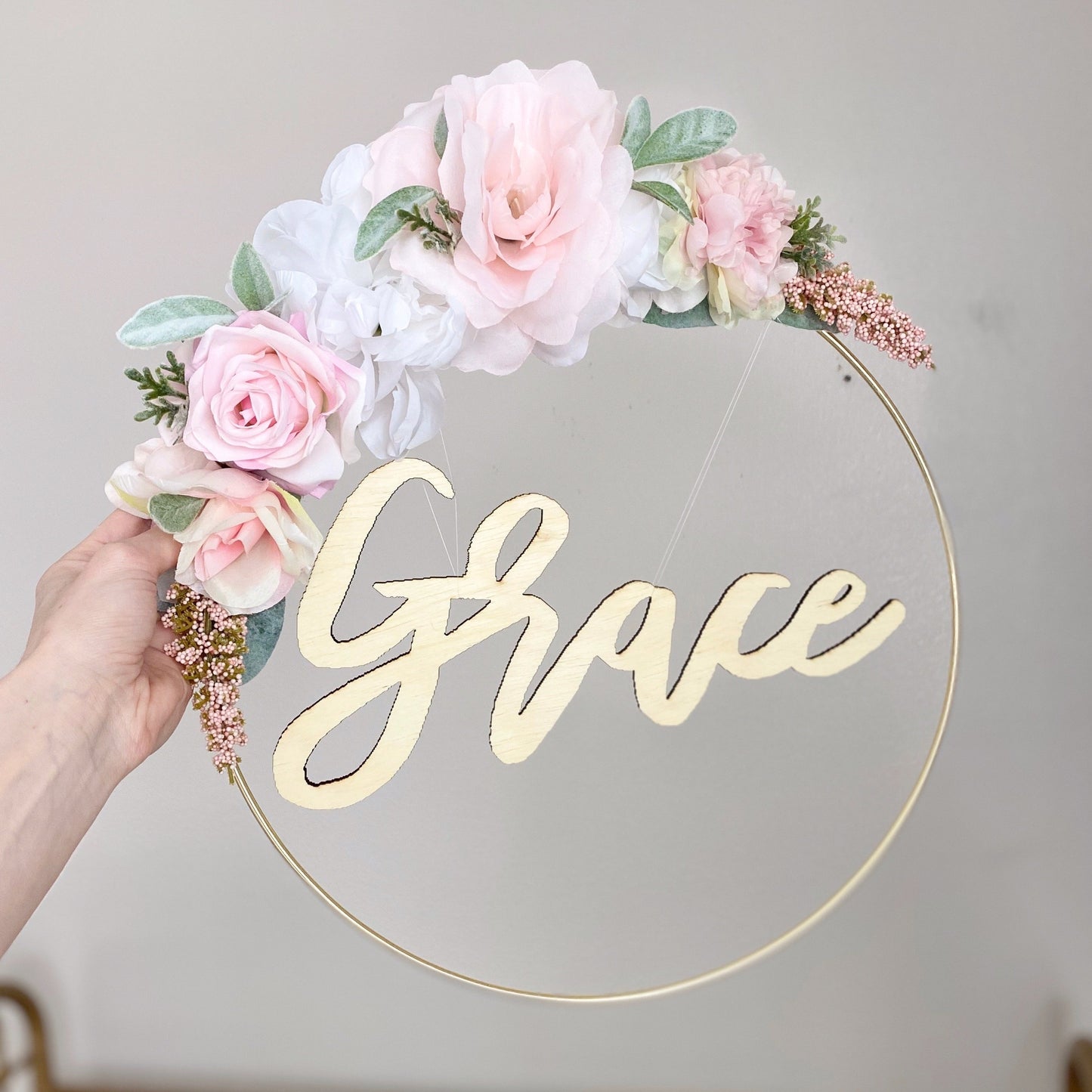 Close-up spring flower hoop wreath detailed silk blooms