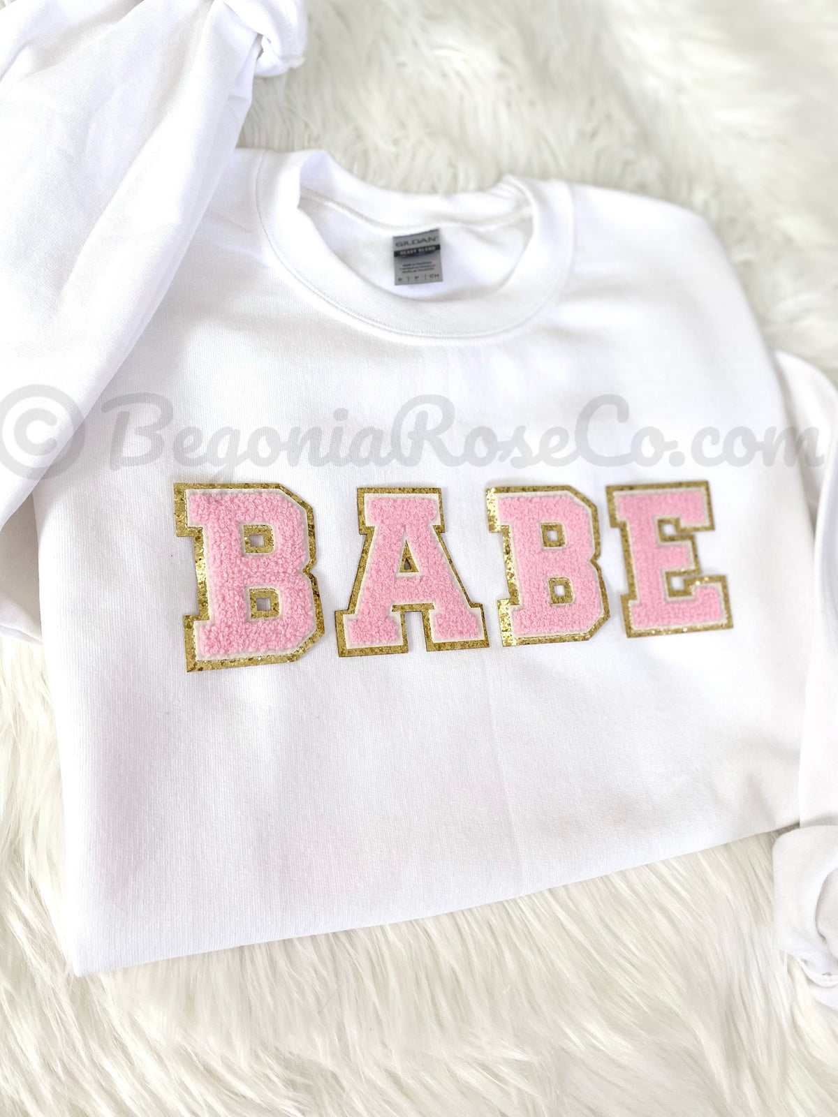 BABE patch sweatshirt flat lay in white with light pink chenille letters