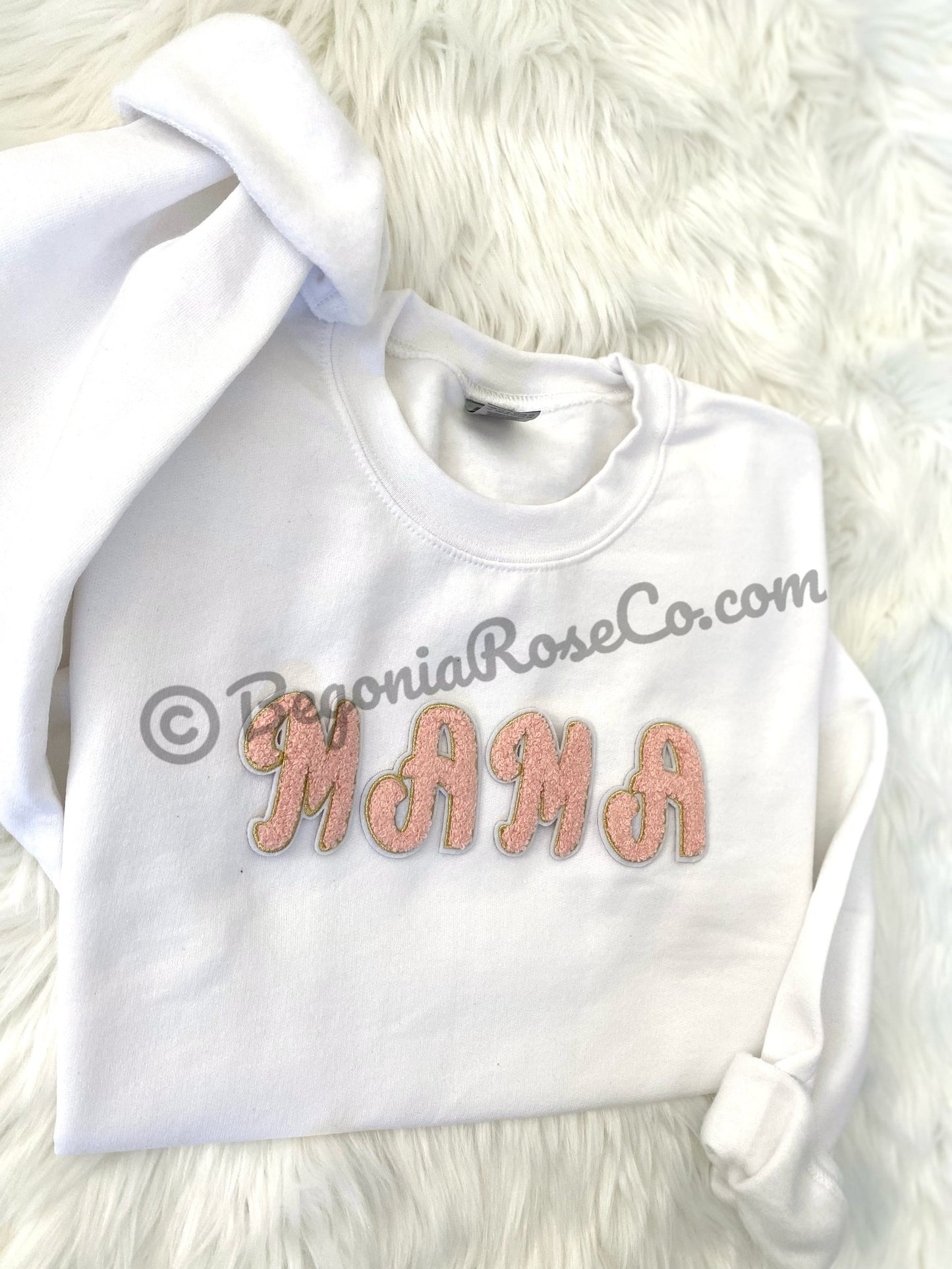 Chenille letter patches in pink on white textured background