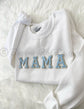 White crewneck sweatshirt with blue chenille MAMA patch letters