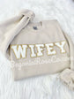 WIFEY chenille patch sweatshirt in white close-up - bride honeymoon shirt