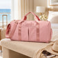 Pink weekender duffel bag with a custom name by a sunny bedroom window