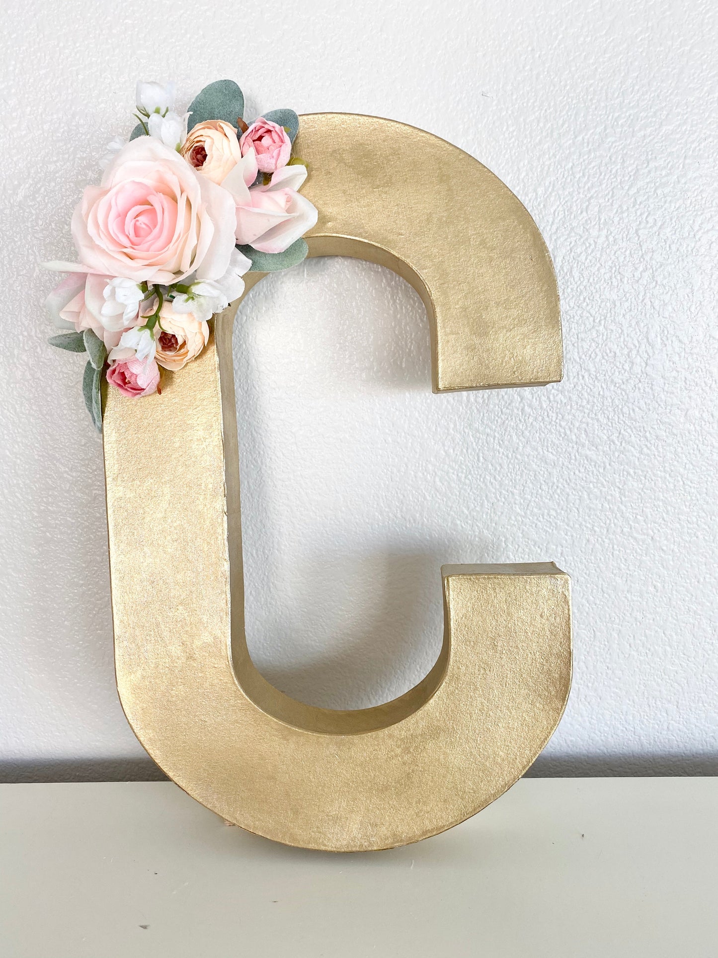 Rose gold floral initial cake table display bridal shower