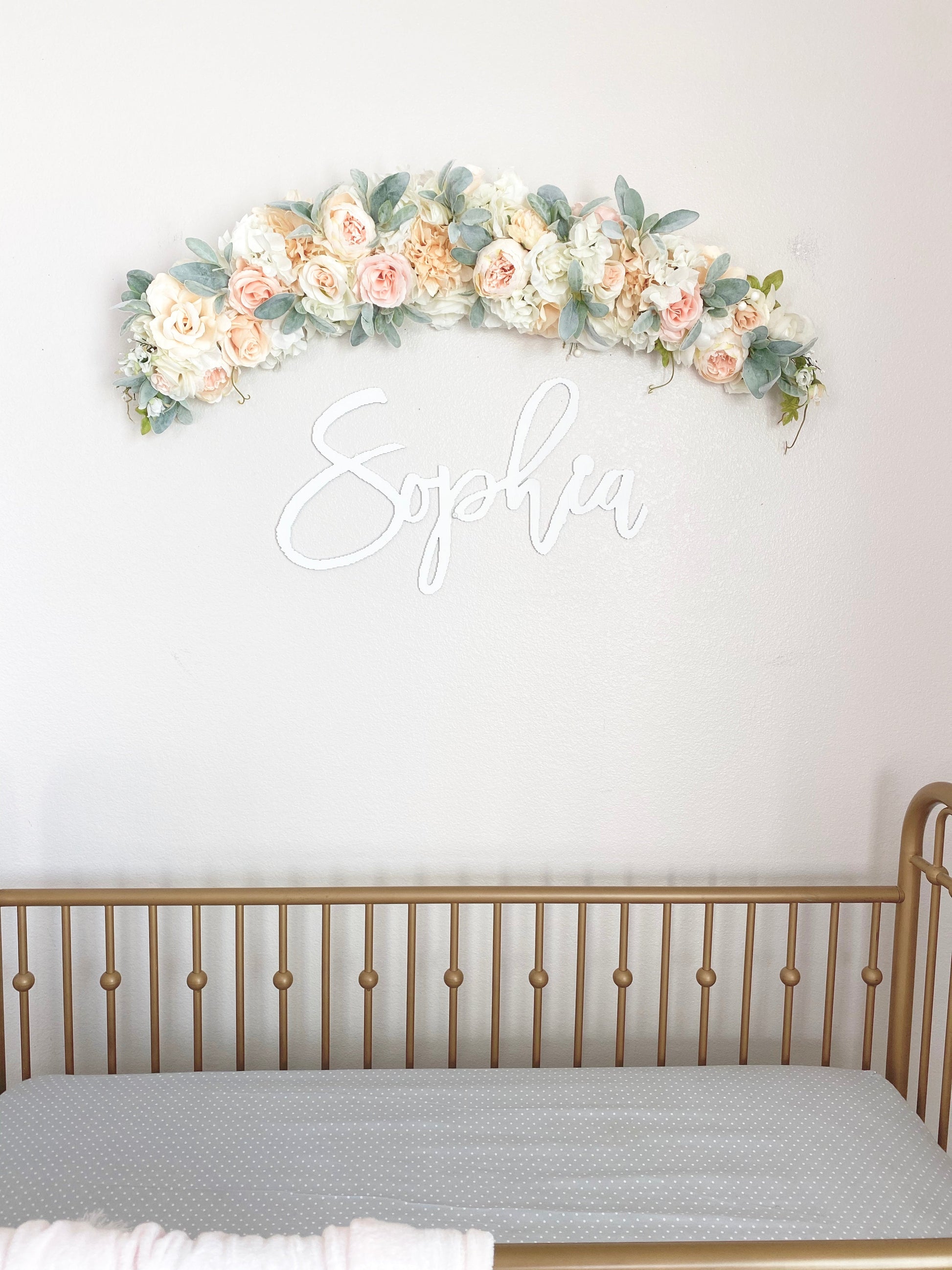 Custom greenery swag with artificial blooms for bridal shower and baby shower wall decor