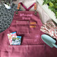 Canvas gardening apron with pocket worn for garden and greenhouse work