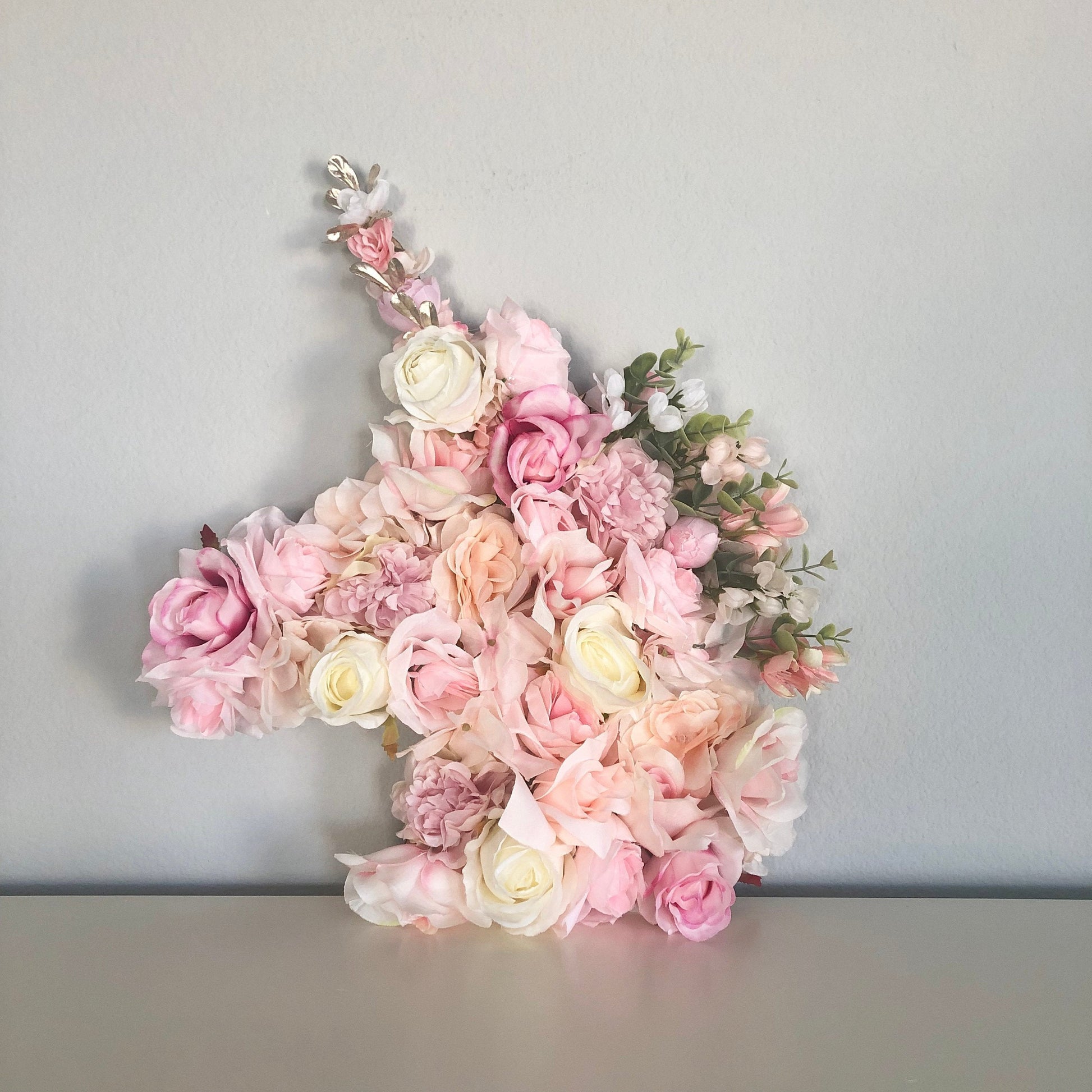 Flower covered unicorn wall decor