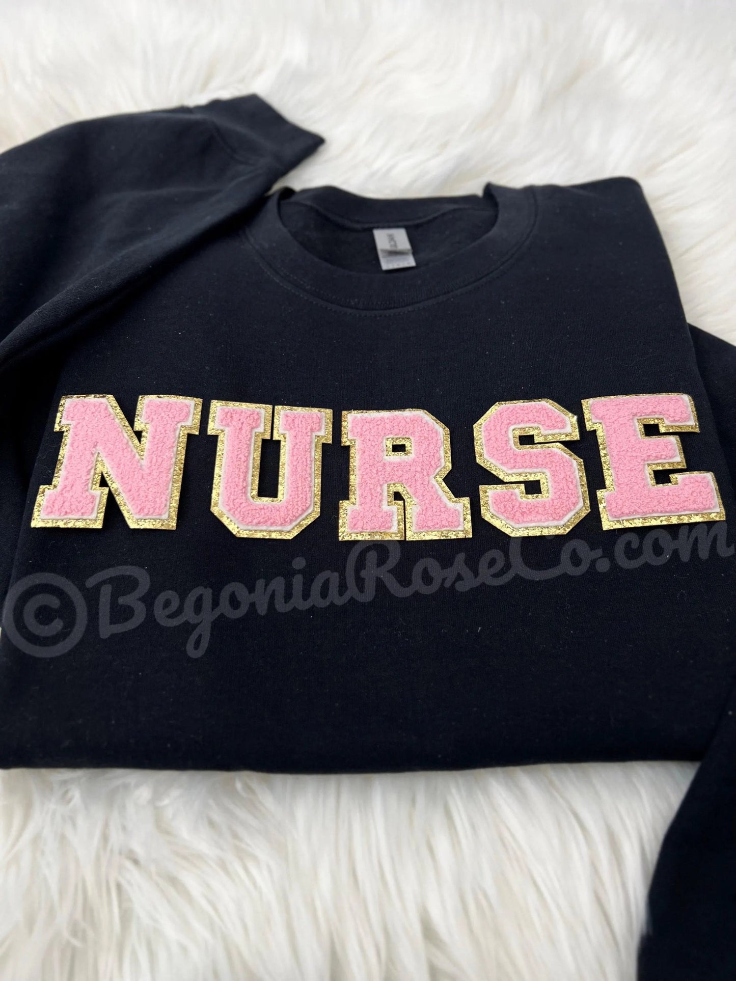 Model wearing chenille NURSE patch crewneck sweatshirt in grey - nurse birthday gift