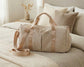Custom monogrammed weekender duffel bag with gold-tone hardware for travel