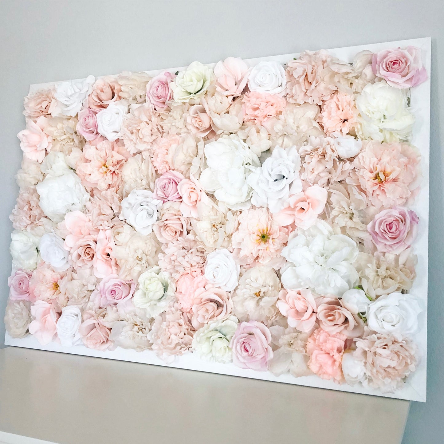 Blush and champagne silk flower wall for boho baby shower decor