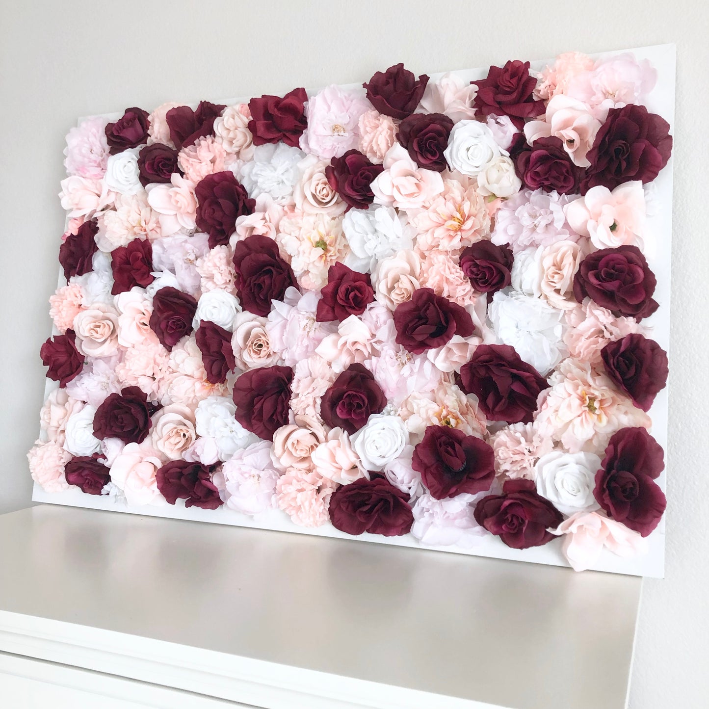 Blush and burgundy silk flower wall backdrop for wedding and nursery