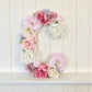 Floral letter pink and cream decor for baby shower