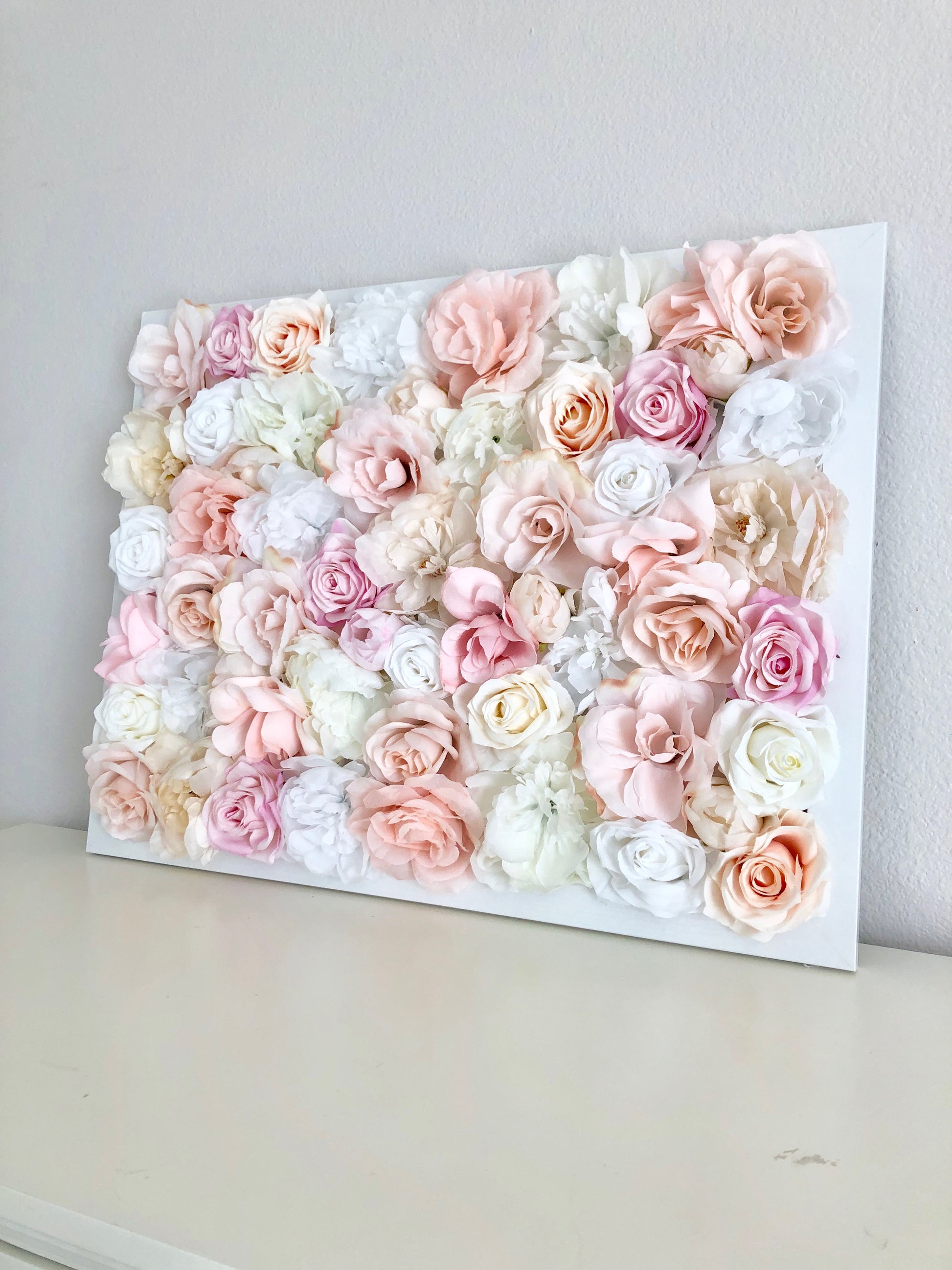 Blush and gold silk flower wall hanging for nursery and shower decor