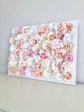 Blush and gold silk flower wall hanging for nursery and shower decor