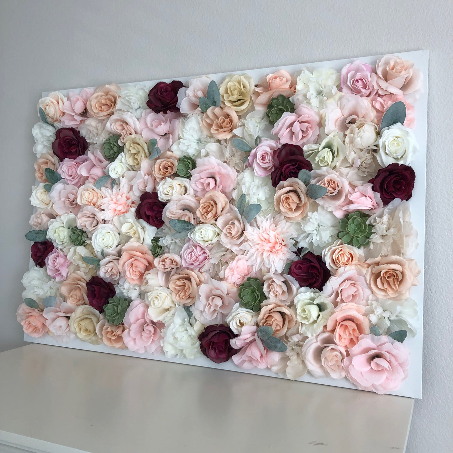 Blush and burgundy silk flower wall backdrop for wedding and nursery