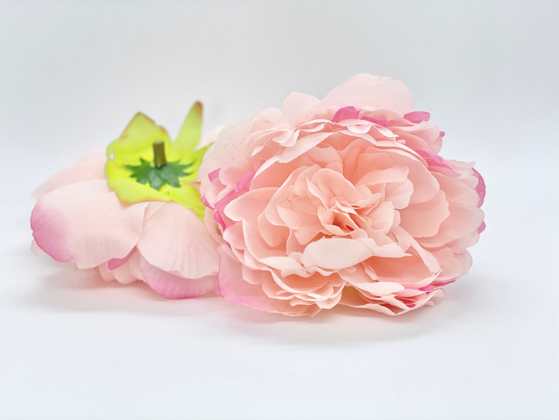 Light pink artificial peony top view for cake and party decor