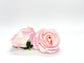 Pale pink faux rose head showing natural petal variation for arrangements