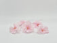 Set of 5 light pink faux cherry blossoms side view showing 2.5-inch bloom size