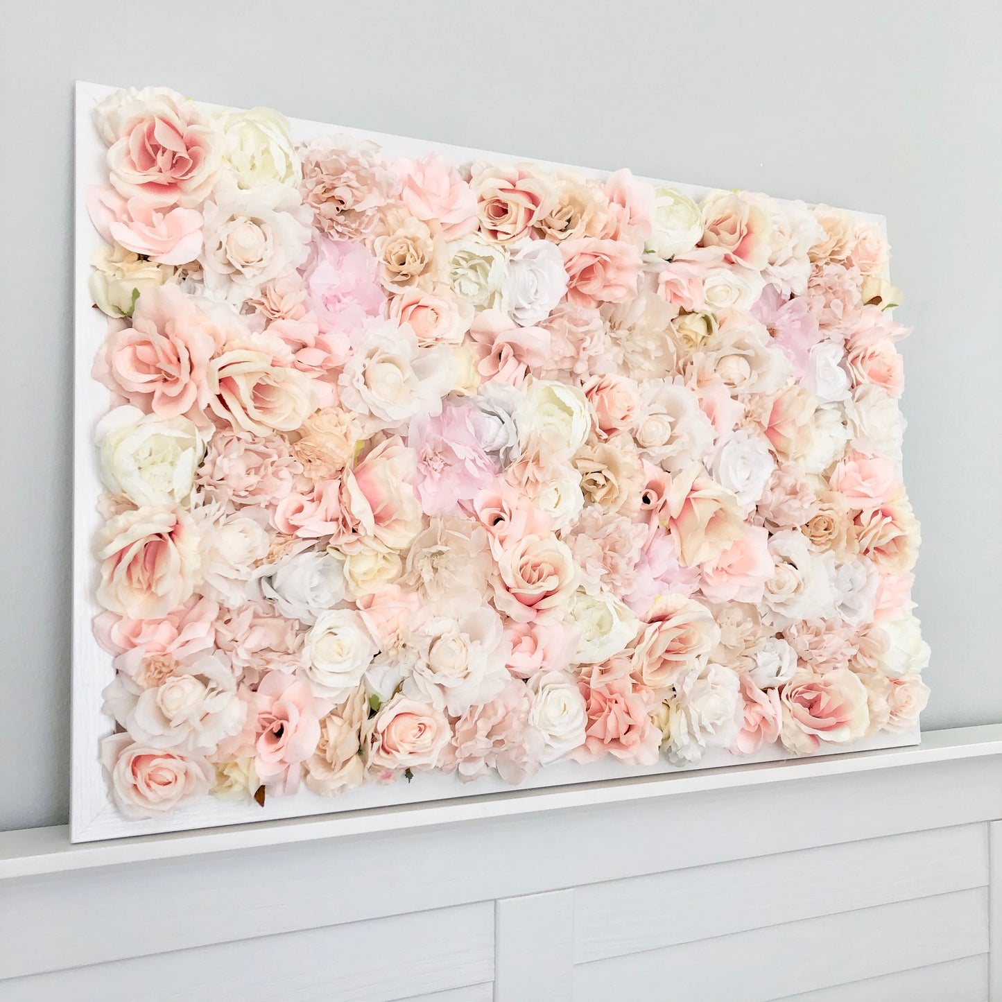 Custom silk flower wall with peony and rose blooms for nursery wall decor