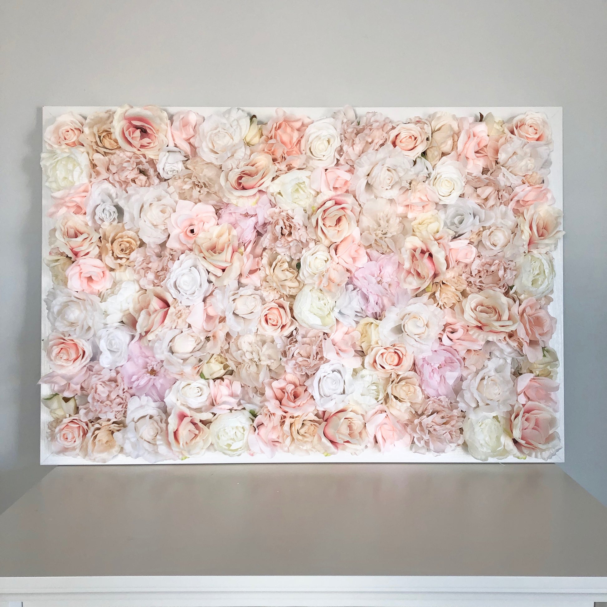 Custom silk flower wall with peony and rose blooms for nursery wall decor