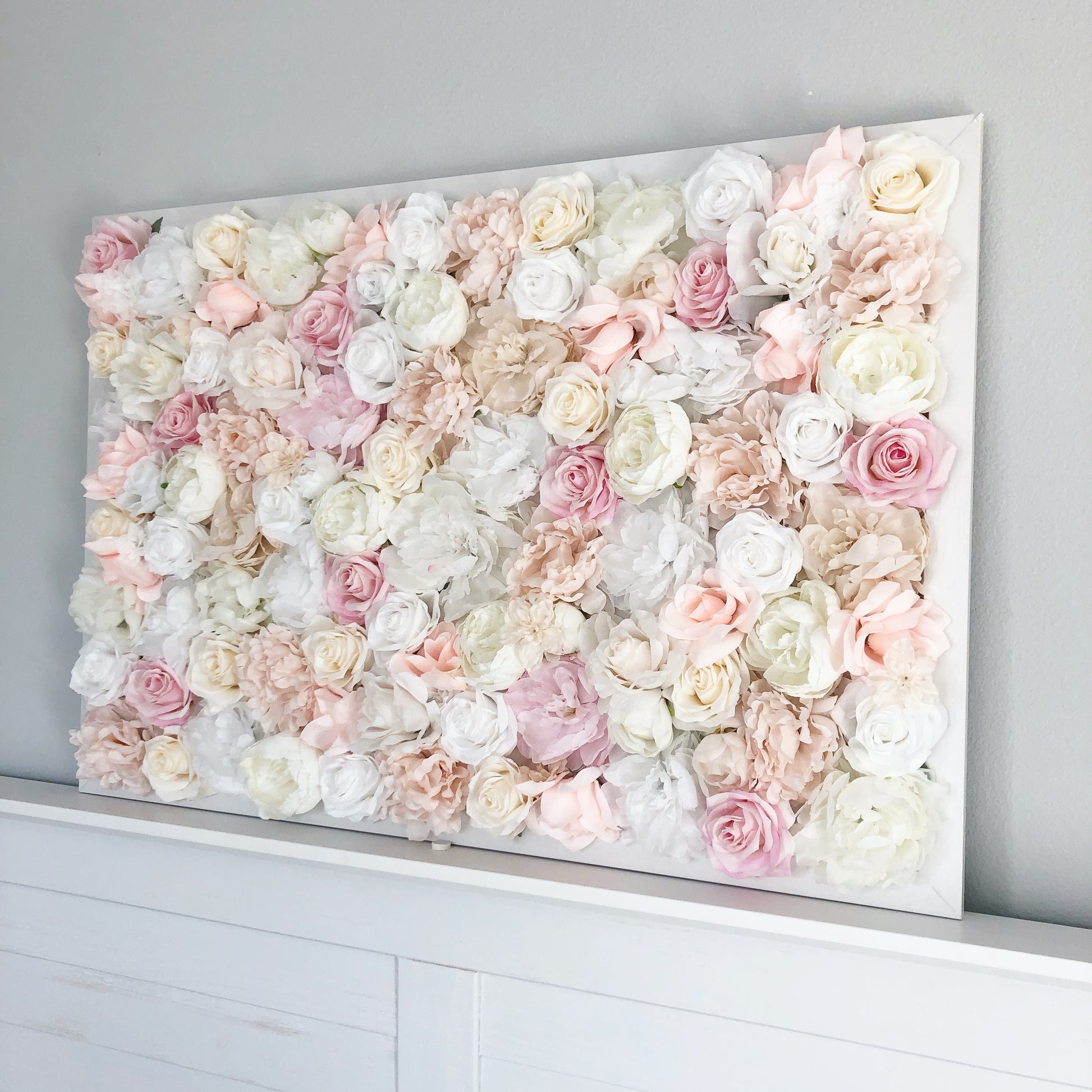 Custom blush silk flower wall with peony blooms for girl nursery decor