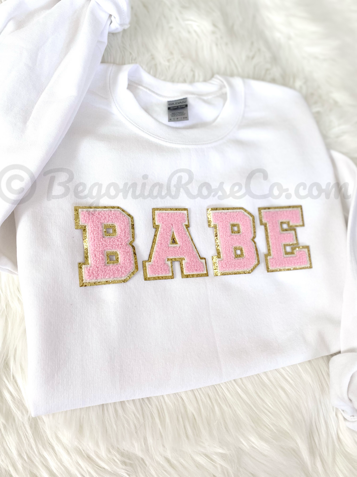 BABE patch sweatshirt flat lay in white with light pink chenille patch
