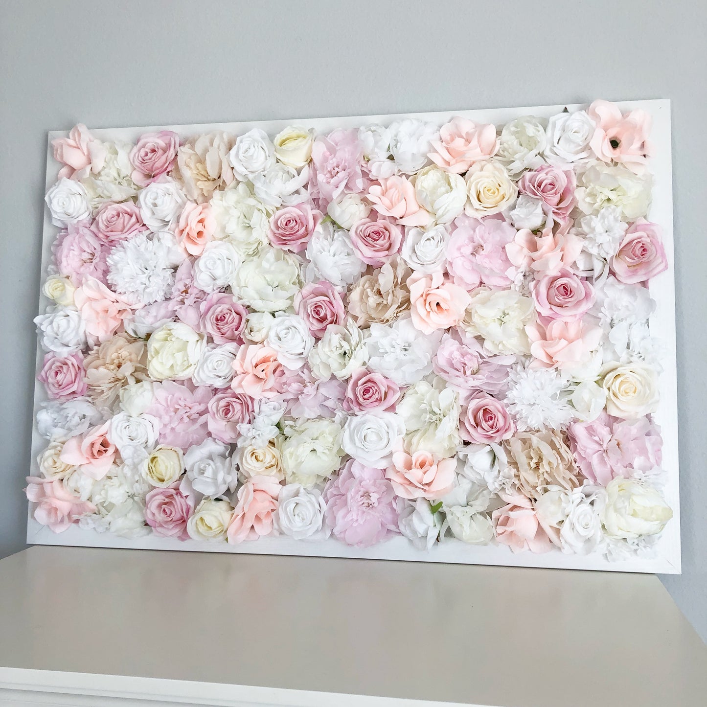 Blush silk flower wall with peony and rose blooms for girl nursery decor