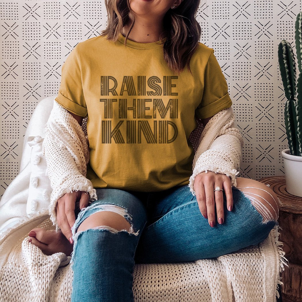 Raise Them Kind Graphic T-Shirt mustard sublimation parenting tee