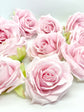 Soft pink artificial rose with layered petals for floral arrangements