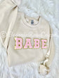 Model wearing chenille BABE patch crewneck sweatshirt - best friend and bachelorette gift