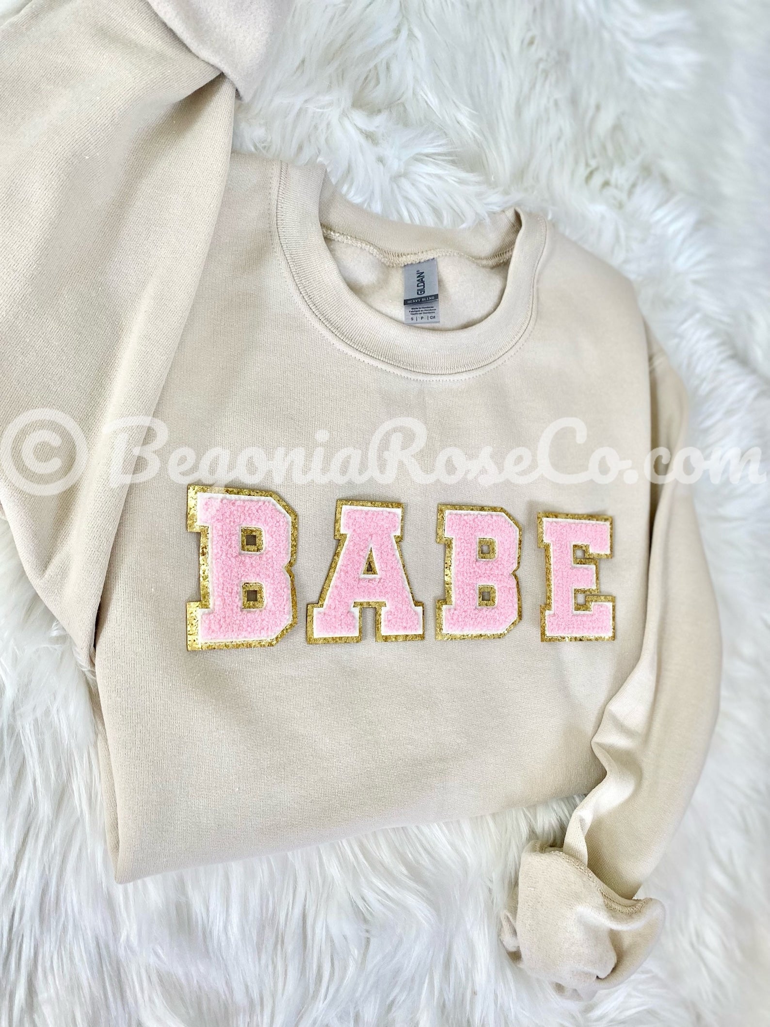 Side view of BABE patch crewneck sweatshirt showing fit and length