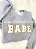Model wearing chenille BABE patch crewneck sweatshirt - bachelorette and best friend gift