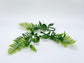 Flat lay of 3 artificial tropical palm greenery accents for DIY floral arrangements